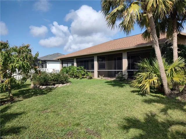 View of yard featuring a sunroom