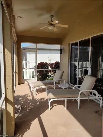 Sunroom / solarium featuring ceiling fan and lofted ceiling