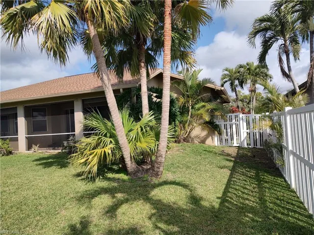 View of yard featuring a sunroom