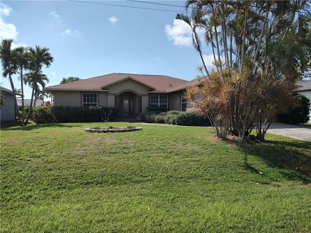 Single story home featuring a front yard