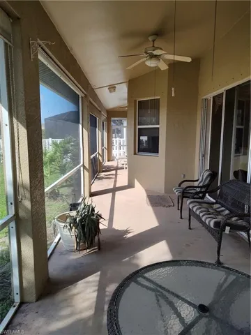 Sunroom / solarium featuring vaulted ceiling and ceiling fan