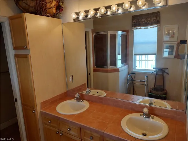Bathroom featuring vanity and walk in shower