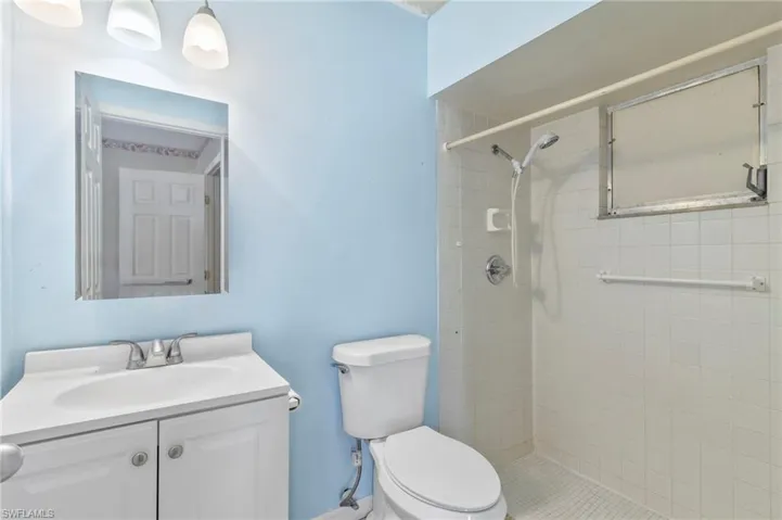 Bathroom with vanity and a stall shower