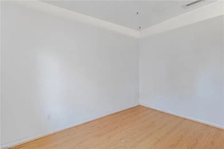 Empty room featuring light wood-style floors and baseboards