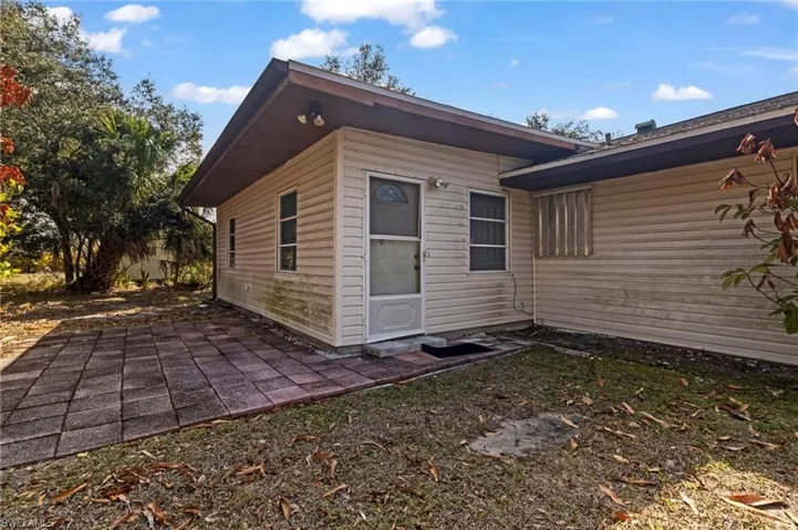 View of property exterior featuring a patio area