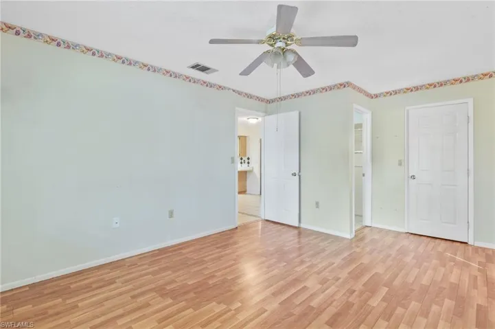 Unfurnished bedroom featuring light wood finished floors and ceiling fan