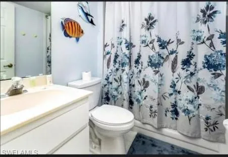 Bathroom featuring vanity and shower / bath combo