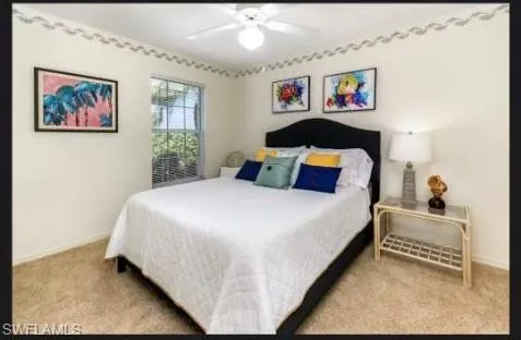 Bedroom with carpet and a ceiling fan