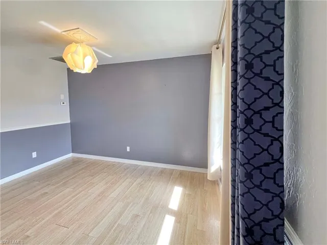 Unfurnished living room featuring hardwood / wood-style floors
