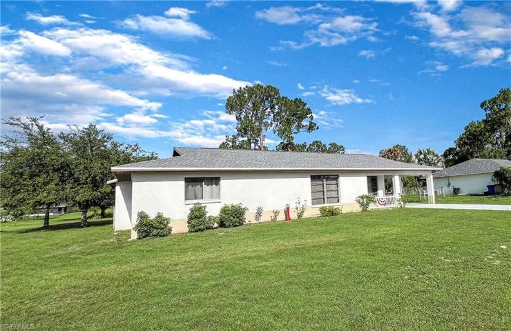 Single story home with a front lawn