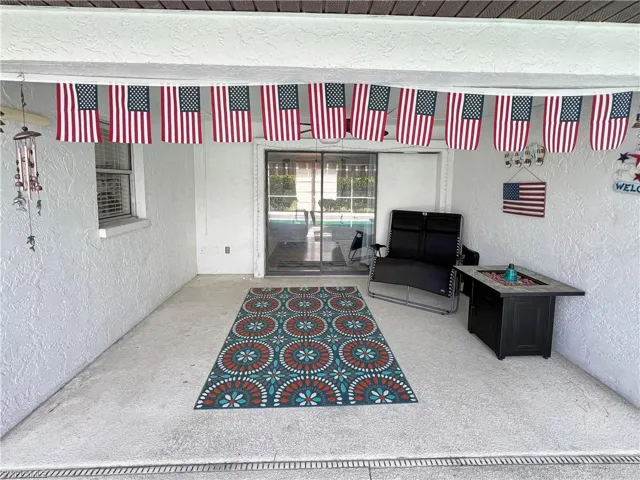 Doorway to property with a patio area