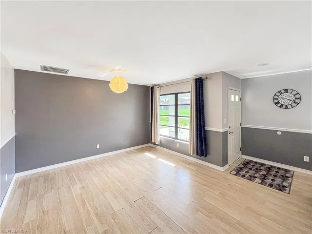 Unfurnished living room featuring light hardwood / wood-style floors