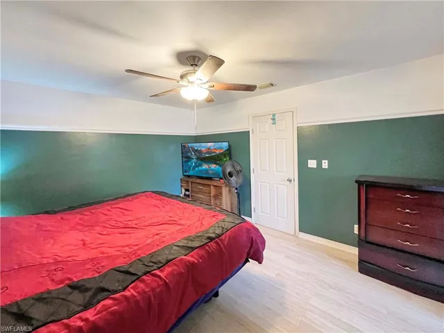 Bedroom with light wood-type flooring and ceiling fan