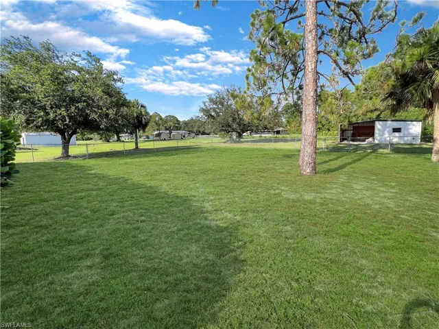 View of yard featuring an outdoor structure