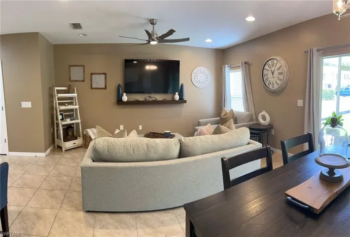 Tiled living room with ceiling fan