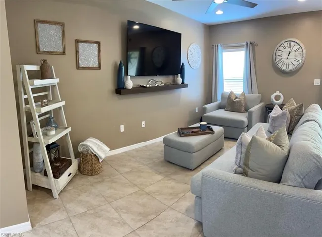 Tiled living room with ceiling fan