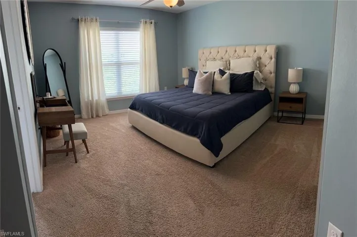 Bedroom with carpet and ceiling fan