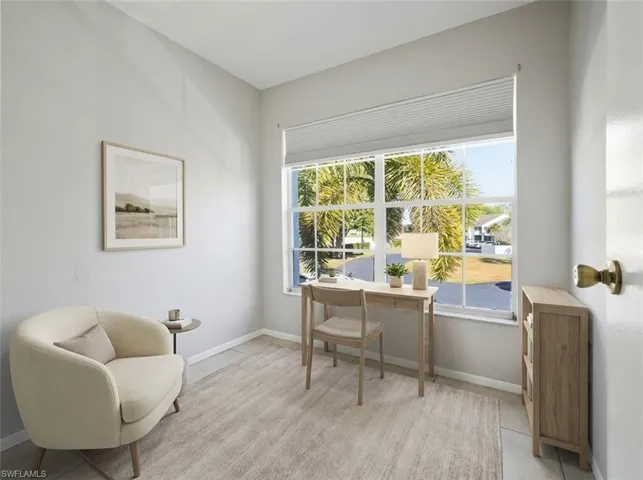 Office / Den horizontal blinds, light-toned walls, and tile flooring