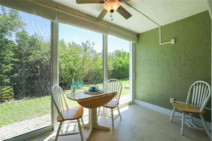 Updated Enclosed Lanai with High Impact Slider Windows & Lovely Backyard Area-Peaceful Views and/or Pet Run area