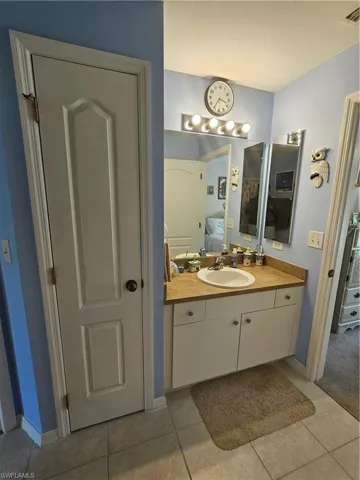 Bathroom with vanity and tile patterned flooring
