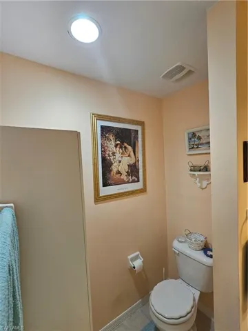 Bathroom featuring tile patterned flooring and toilet