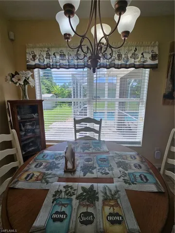 Dining area with an inviting chandelier