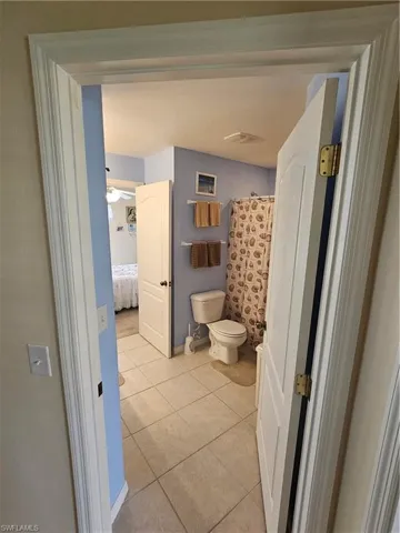 Bathroom featuring toilet and tile patterned floors