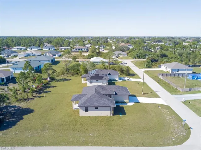 Aerial overview of property's location featuring nearby suburban area