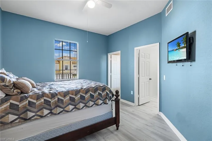 Bedroom featuring ceiling fan and light wood-type flooring