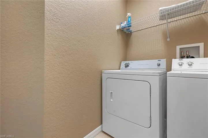 Laundry room featuring washing machine and clothes dryer