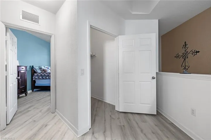 Hall featuring light hardwood / wood-style floors