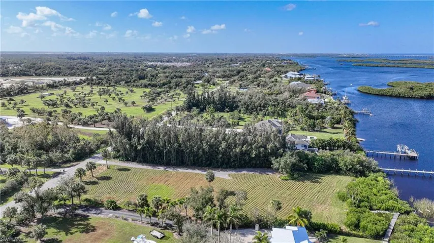 Aerial view featuring a water view and a rural view