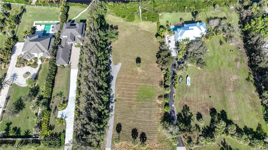 Birds eye view of property with a rural view