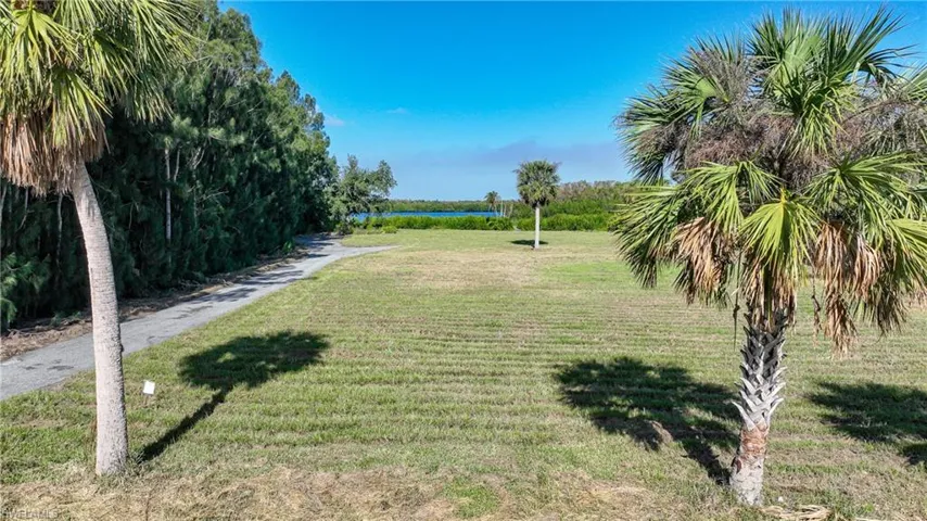 View of property's community featuring a lawn