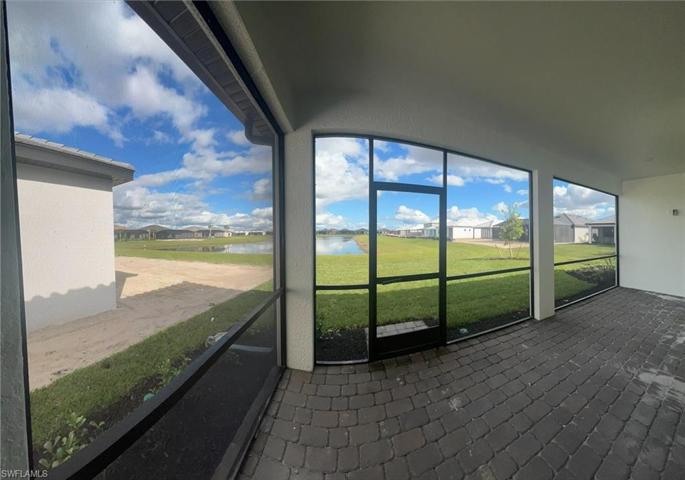 View inside extended covered lanai - water view