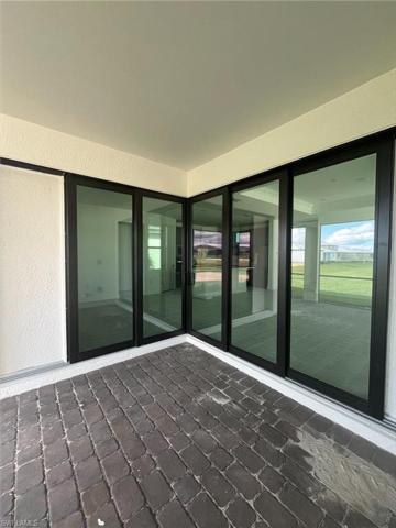 Inside extended covered lanai - zero corner sliding doors