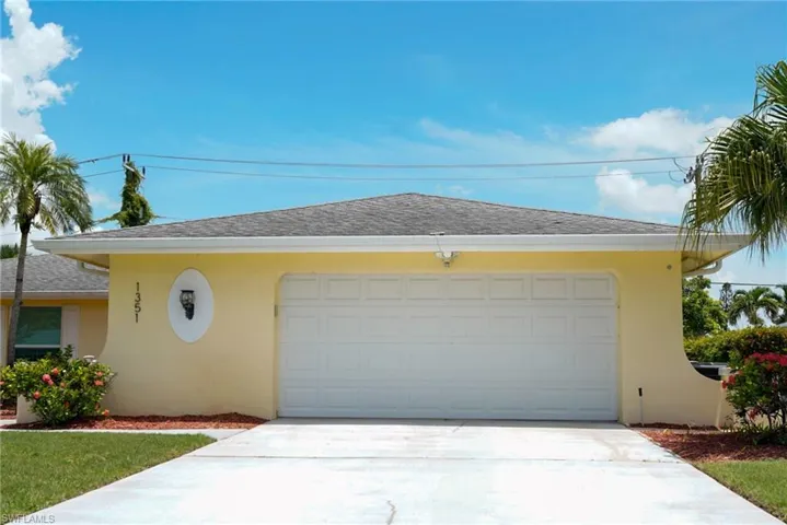 View of front of house featuring a garage, stucco siding, concrete driveway, and a shingled roof
