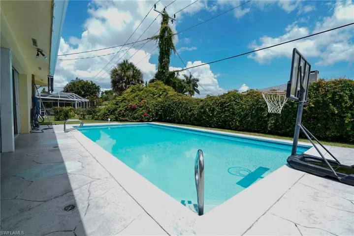 Swimming pool with a patio