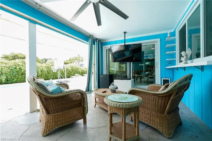 Sunroom with a ceiling fan