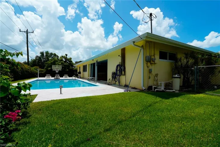 Rear view of property featuring stucco siding and a patio area