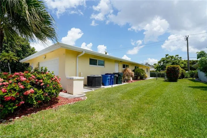Back of property featuring stucco siding and an attached garage