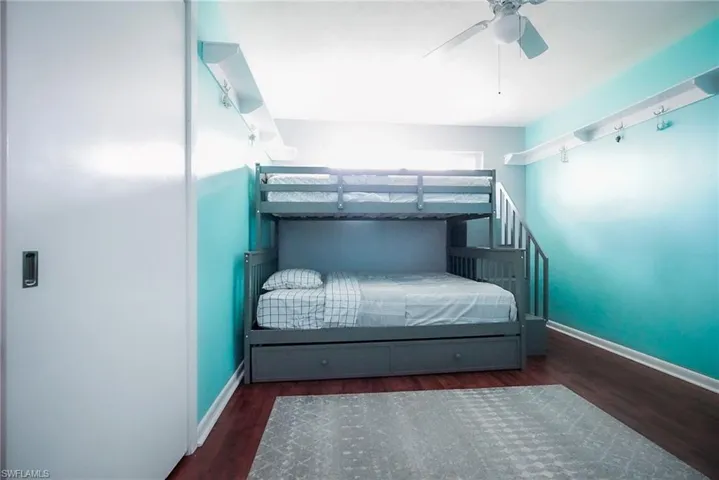 Bedroom with wood finished floors and a ceiling fan