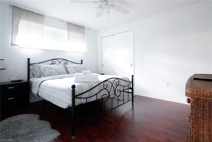 Bedroom with wood finished floors and a ceiling fan
