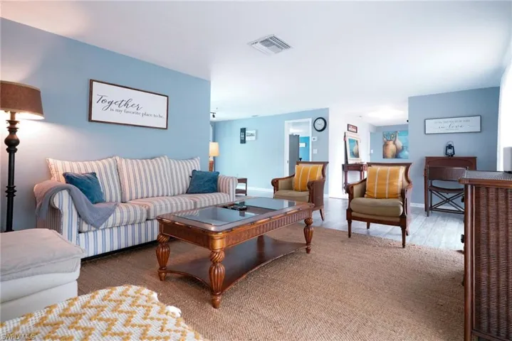 Living area featuring wood finished floors and baseboards
