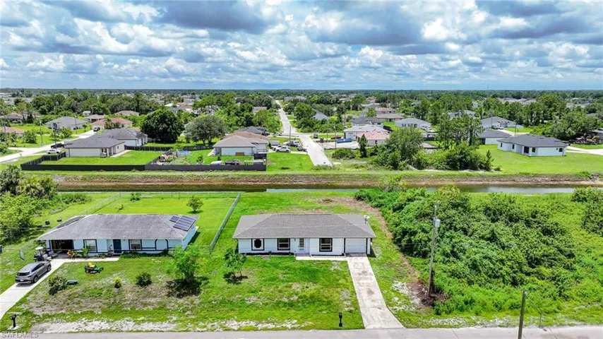 Aerial view of residential area with a large body of water