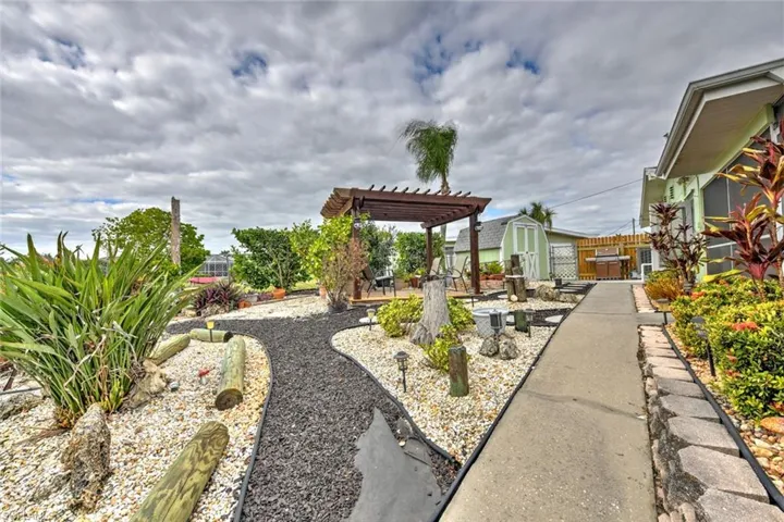 View of yard featuring a pergola