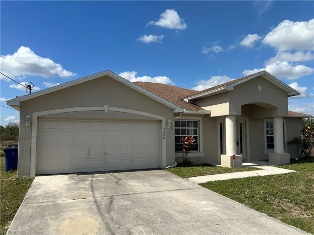 Single story home featuring a garage