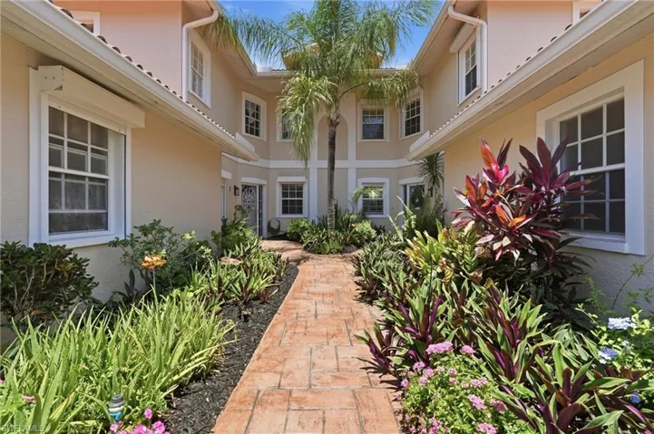 BEAUTIFUL ENTRY INTO THIS FIRST FLOOR COACH HOME!!  NEWLY PAINTED EXTERIOR OF BUILDING..