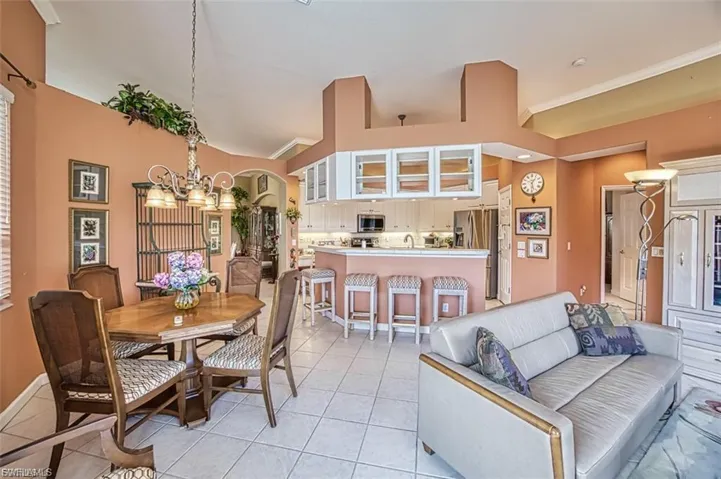 Dining space with a chandelier and light tile patterned floors