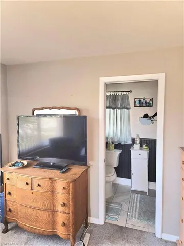 Bedroom with tile floors